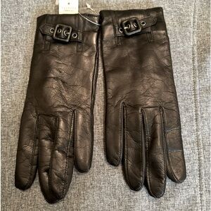 Black Italian leather never worn Talbots gloves. Buckle on front